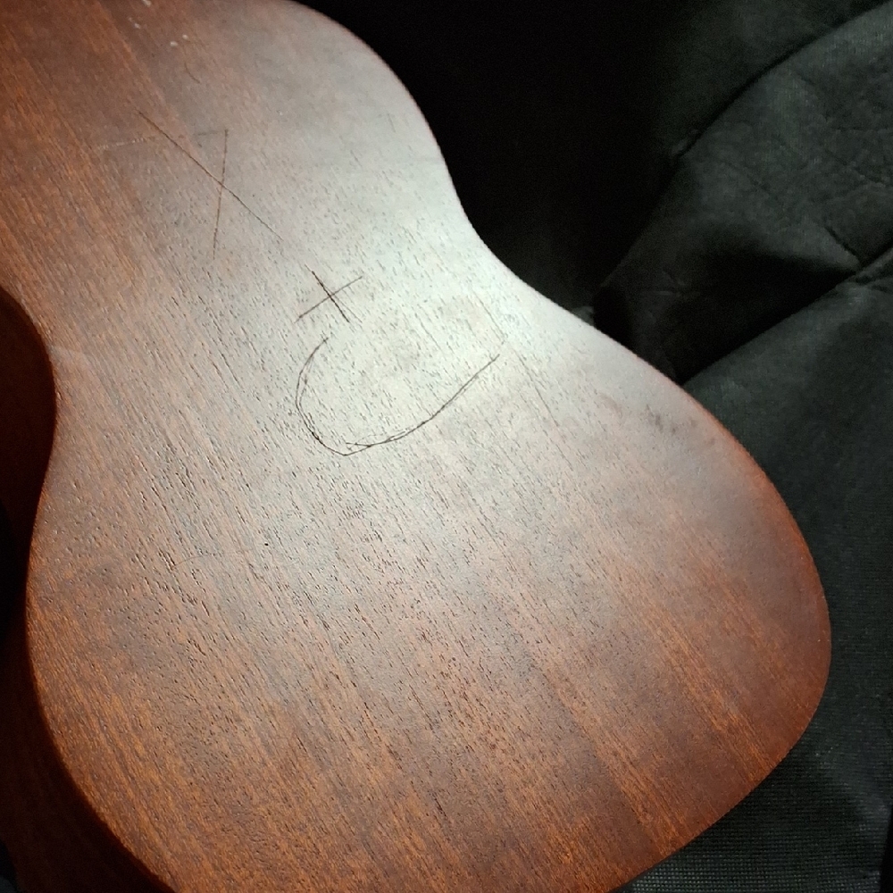 Intricately Carved Brown Ukulele - Picture 4 of 7